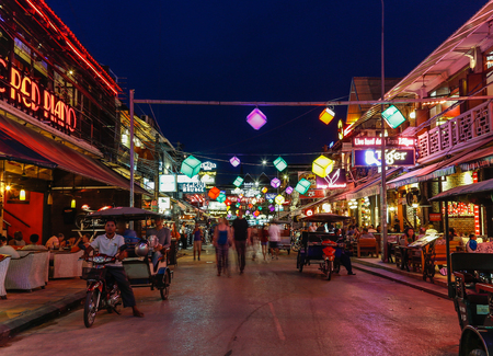 SIEM REAP, CAMBODIA - 29TH MARCH 2017: Bars, restaurants and lights along Pub Street in Siem Reap Cambodia at night. Lots of people can be seen.のeditorial素材