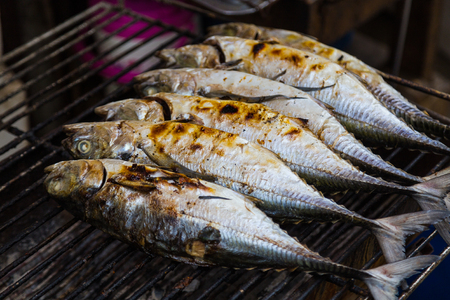 Closeup to grilled fish on a BBQ in Asia.の写真素材