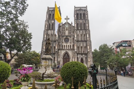 HANOI, VIETNAM,  19TH MARCH 2017: The outside of St Joseph Cathedral in Hanoi old district during the day. This church is from 1886. People can be seen outside.のeditorial素材