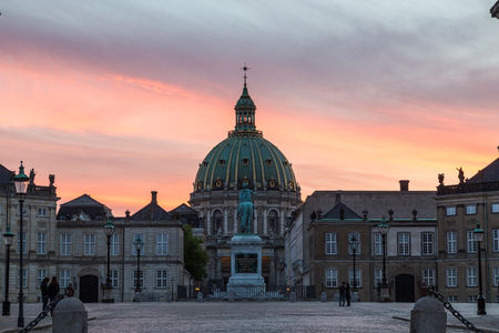 COPENHAGEN, DENMARK - 24TH MAY 2017: A view towards the Frederik's Church at sunset. Part of Amalienborg, people and a colourful sky can be seen.のeditorial素材
