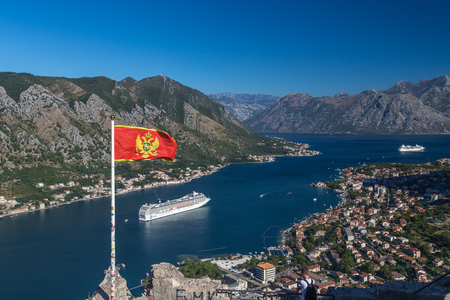KOTOR, MONTENEGRO - 13TH AUGUST 2016: V view of the Kotor skyline in the morning in the summer. An MSC Cruise liner can be seen.のeditorial素材