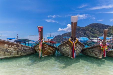 KO PHI PHI DON, THAILAND - 31ST MARCH 2017: Lots of traditional long-tail boats in Ko Phi Phi Thailand during the day.のeditorial素材