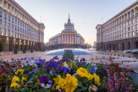 SOFIA, BULGARIA - 3RD APRIL 2018: The outside of the buildings at the Largo in Sofia. Showing the Party House,  TZUM department store and flowers in the foregroundのeditorial素材