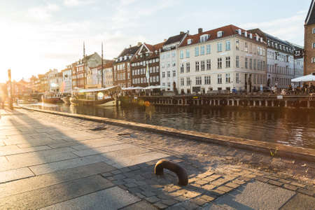 COPENHAGEN, DENMARK - 22ND MAY 2017: Views along the Nyhavn in Copenhagen at sunset. People can be seen.のeditorial素材