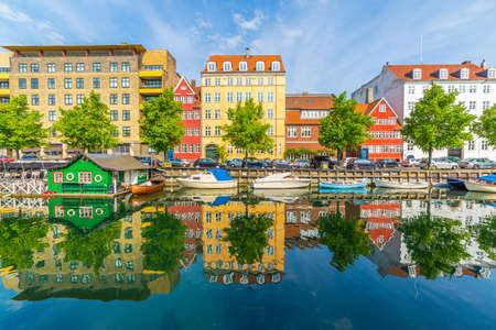 COPENHAGEN, DENMARK - 23RD MAY 2017: Buildings and reflections along the Christianshavn Canal in Copenhagen. People can be seen.のeditorial素材