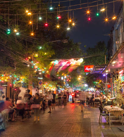BANGKOK, THAILAND - 16TH MARCH 2017: Restaurants and nightlife in Bangkok along Ram Buttri (street) near Khao san road. Lots of people can be seen.のeditorial素材