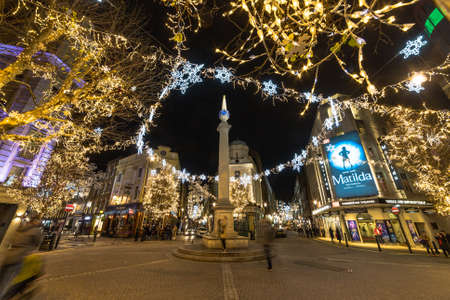 LONDON, UK - 22ND DEC 2018: Seven Dials at Christmas time. Lots of decorations as well as people can be seen.のeditorial素材