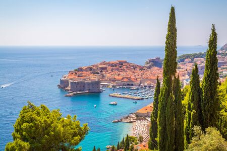 A high view of Dubrovnik Old Town showing the outside of buildings, boats and the sea.の写真素材