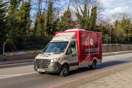 LONDON, UK - 3RD APRIL 2020: An Ocado delivery truck on a road in London during the day. Ocado is an online supermarket where people can buy groceries.のeditorial素材