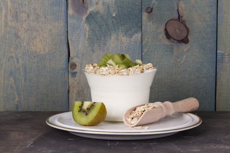 fruit yogurt and muesli with kiwiの写真素材