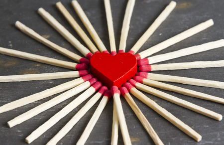 red heart surrounded by matchesの写真素材