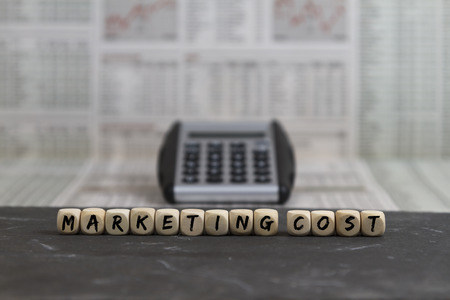 Marketing cost word built with wooden lettersの写真素材