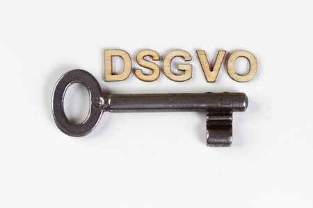 DSGVO word in wooden letters with old keyの写真素材