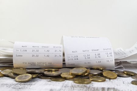 Cash receipts with small change after purchaseの写真素材