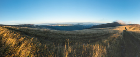 Panorama from morning grassy mountain ridge under blue sky in late summer - Greater Fatra National...