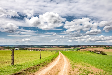 Spring rural countryside with pastures, villages and amazing sky with clouds - Czech Republic, Europeの写真素材