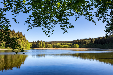 Romantic pond in spring or summer landscape and forests under clear blue sky - Czech Republic, Europeの写真素材