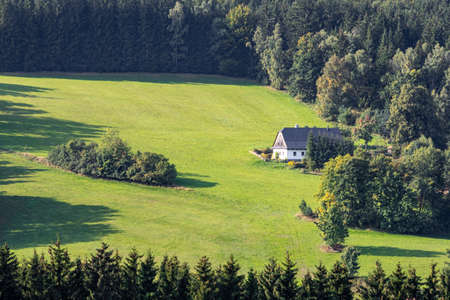 Meadow near the forest with a country cottage - Czech Republic, Europeの写真素材