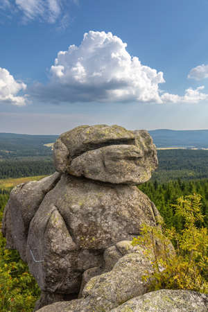 Rock formation and viewpoint called Poaching stones under blue sky with white clouds - Jizera Mountains, Czech Republic, Europeの写真素材