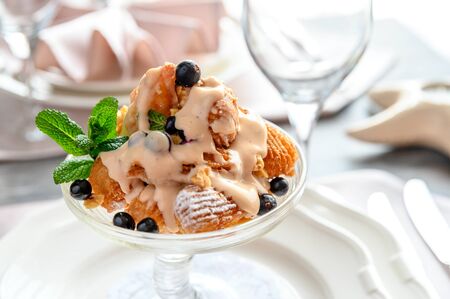 Reserved table at the restaurant. ice cream in the dish