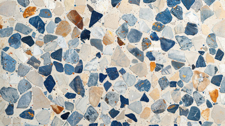 Decorative terrazzo floor surface with beige base and pastel blue decorative chips in a polished finishの素材