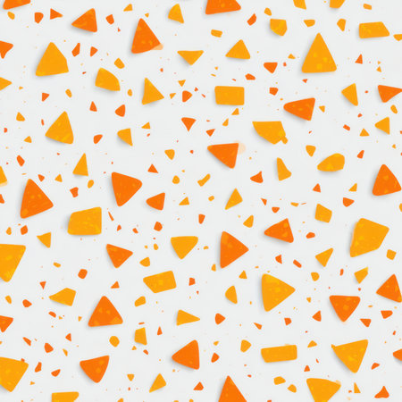 Abstract seamless terrazzo pattern with playful Tangerine geometric fragments in vivid Tangerine scattered on a clean white backgroundの素材