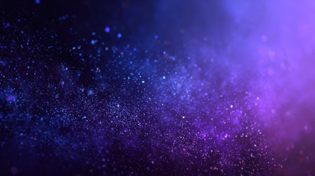 Deep galaxy-inspired gradient of dark blue and purple, glowing softly with granular texture and digital grainの素材