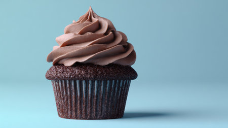 A chocolate cupcake styled like a mini cake, topped with swirl frosting, minimalist pastel background, clean modern lookの素材