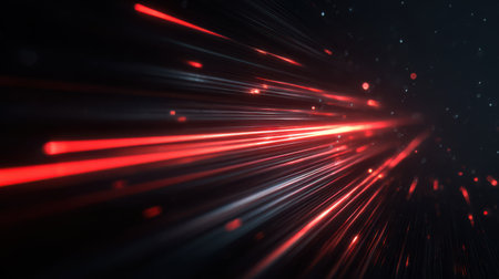 High-speed red light beams cutting through darkness, creating dynamic flare and reflection effects with depth of fieldの素材