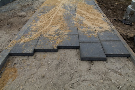 Laying the pavement paving stones road constructionの写真素材