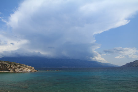 Stony wild Kastelina beach on the island of Rab in Croatia and wild nature azure Adriatic Seaの写真素材