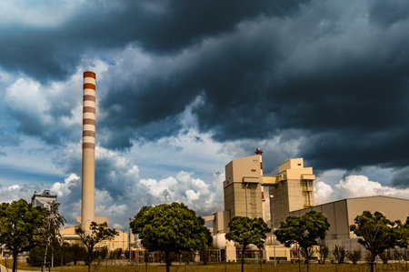 Steelworks buildings in Czestochowa cloudy sky over the factory chimney of the heating plantの写真素材