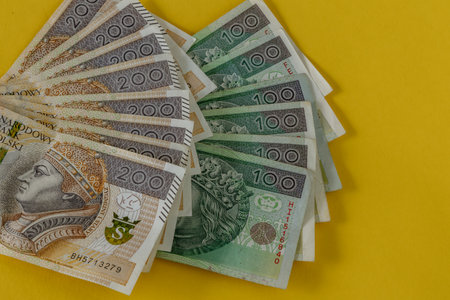 Money on the table, banknotes one hundred and two hundred zlotys in Poland