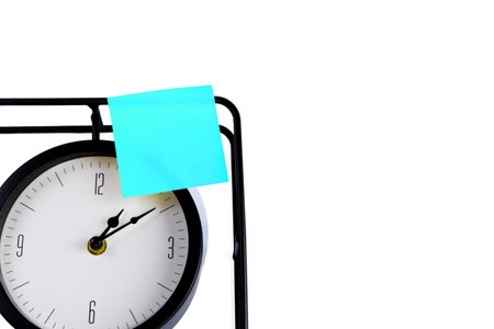 A blue memo-stick stuck on the watch to remind you of an important event