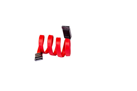 Red SATA cable connecting computer hard drive on white background