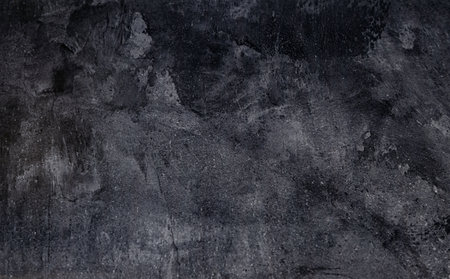 Black grunge wall texture background. Black rough cement wall texture.
