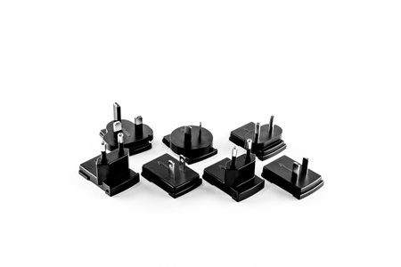 European, Chinese, American electrical socket plug on white table