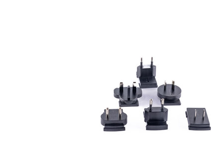 European, Chinese, American electrical socket plug on white tableの写真素材