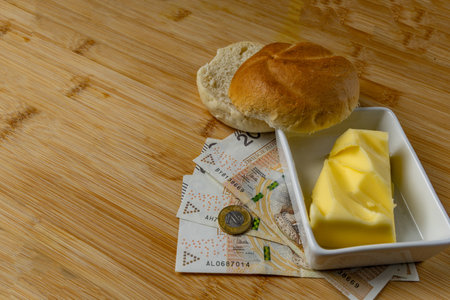Increase in food prices in Poland, bread, butter on a cutting board, tomatoes, sausage, VAT on food...