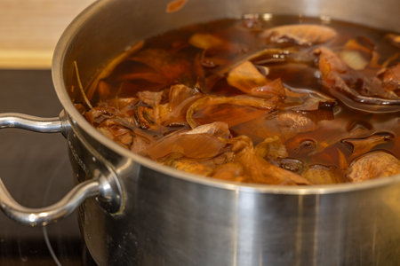 Cooking eggs for ÅšwiÄ™conka in onion skins, Easter decorations