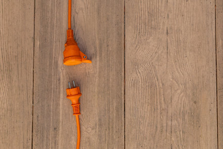 Electric extension cord and power connection in the garden power consumptionの写真素材