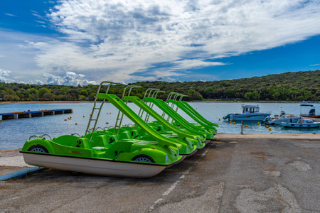 Green pedal boats, recreational water equipment rental, water attractions on the Adriatic Sea Croatia Rovinjの写真素材