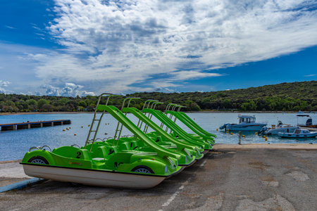 Green pedal boats, recreational water equipment rental, water attractions on the Adriatic Sea Croatia Rovinjの写真素材