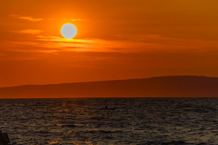 Sunset in Croatia in love on the sea shore Trpanj Croatiaの写真素材