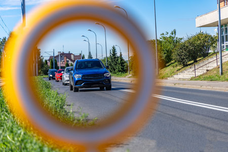 Road accident on the lanes next to a marked pedestrian crossing to school, damaged road sign, reflective figure warning about the pedestrian crossing torn off,の写真素材