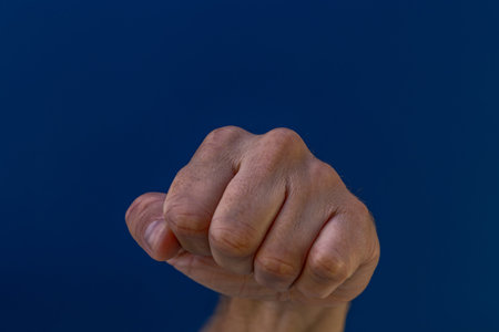 A clenched male hand into a fist.の写真素材