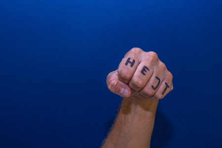 A clenched male hand into a fist