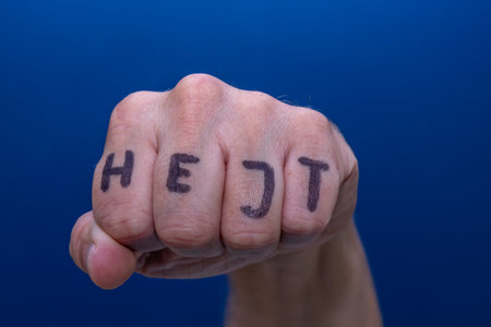 A clenched male hand into a fist, preparation for fightの写真素材