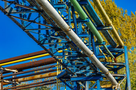 Smoke and steam released from the old factory chimney Rusty, leaky central heating system, cracked pipesの写真素材