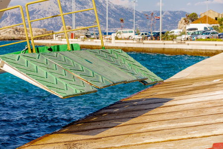 A passenger ship enters the seaport of Trpanj on the Peljesac Peninsula in Croatiaの写真素材